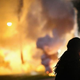 A demonstrator protesting the shooting death of teenager Michael Brown scrambles for cover as police fire tear gas in Ferguson, Mo., on Aug. 13, 2014.
Scott Olson/Getty Images